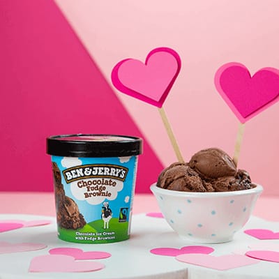 A pint of Chocolate Fudge Brownie and a bowl of it with heart around it